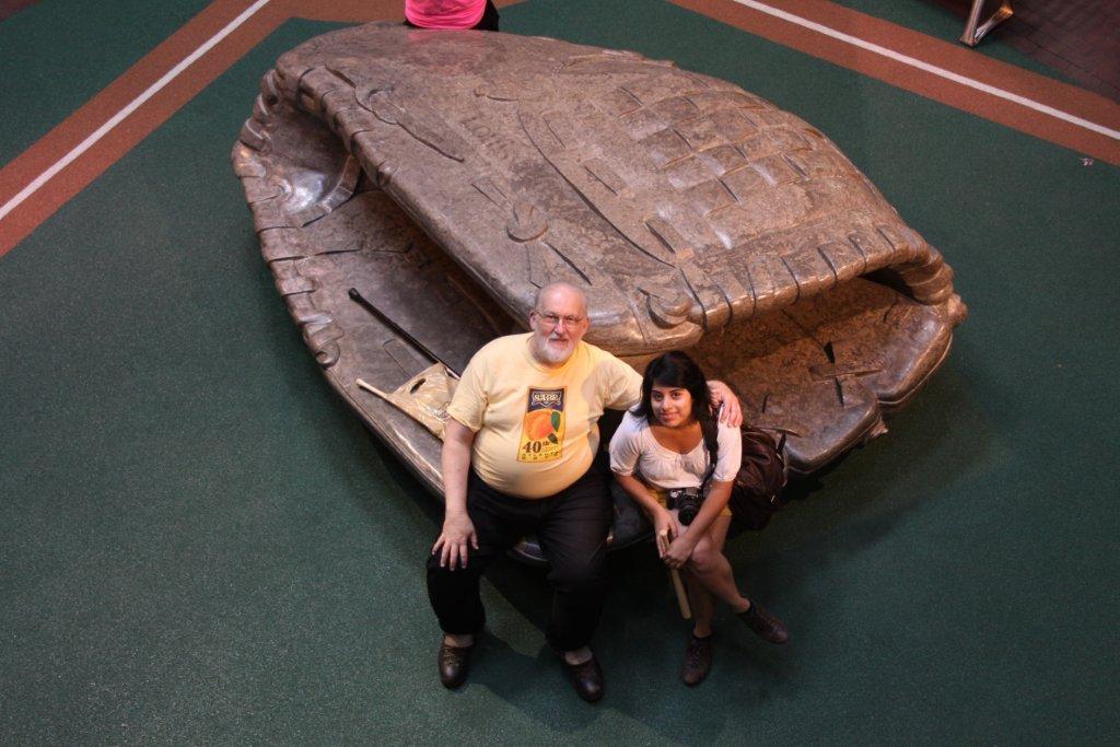 Waff with stepdaughter Roxana Bell sitting in a giant catcher&rsquo;s mitt at the Louisville Slugger factory museum in August 2010.